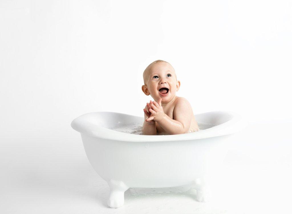 Happy baby in bath